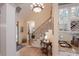 Elegant foyer with hardwood floors and staircase with wrought iron railing at 104 Hallmark Xing, Rock Hill, SC 29732