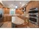 Spacious kitchen with stainless steel appliances, custom cabinets, and light countertops at 104 Hallmark Xing, Rock Hill, SC 29732