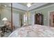 Comfortable bedroom with natural light, tray ceiling, and hardwood floors at 104 Hallmark Xing, Rock Hill, SC 29732