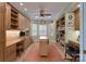Spacious home office featuring custom shelving, large desk, and warm paint tones at 104 Hallmark Xing, Rock Hill, SC 29732