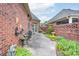 Paver patio featuring outdoor seating, plants, and a brick wall, creating a cozy outdoor space at 104 Hallmark Xing, Rock Hill, SC 29732