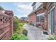 A brick paver patio with outdoor seating, potted plants, and a view of the home's exterior at 104 Hallmark Xing, Rock Hill, SC 29732