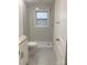 Updated bathroom with tiled walk-in shower, patterned floors, and granite topped vanity at 109 Barrett Rd, Cherryville, NC 28021