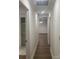 Hallway with sleek, modern flooring connects to a dining area, and includes ample storage at 109 Barrett Rd, Cherryville, NC 28021