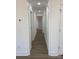 Bright hallway with modern flooring and clean white trim leads to other rooms at 109 Barrett Rd, Cherryville, NC 28021