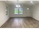Inviting living room with hardwood flooring, light-filled windows, and a welcoming entryway at 109 Barrett Rd, Cherryville, NC 28021