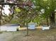 Well-maintained, grassy lot with mature trees and multiple detached outbuildings at 109 Barrett Rd, Cherryville, NC 28021