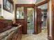 Bathroom with custom-built vanity, glass shower, and view into walk-in closet, creating a spa-like experience at 111 Milledge Dr, Mooresville, NC 28117