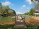 Private dock offers serene lake views surrounded by lush greenery, perfect for relaxing and enjoying nature at 111 Milledge Dr, Mooresville, NC 28117
