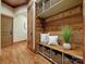Charming entryway with wooden accent wall, bench seating, and storage baskets, providing a welcoming and organized space at 111 Milledge Dr, Mooresville, NC 28117