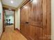 Hallway with wood flooring and a view into the exercise room at 111 Milledge Dr, Mooresville, NC 28117
