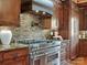 Gourmet kitchen equipped with a professional-grade range and stylish backsplash at 111 Milledge Dr, Mooresville, NC 28117