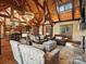 Inviting living room with a fireplace, exposed beams, and an open layout to the kitchen at 111 Milledge Dr, Mooresville, NC 28117