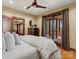Serene main bedroom features soft bedding, wood furnishings, and a private access to the outdoors at 111 Milledge Dr, Mooresville, NC 28117