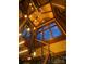 Unique staircase design featuring exposed wood beams, large windows and stylish pendant lighting fixtures at 111 Milledge Dr, Mooresville, NC 28117
