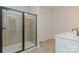 Bathroom featuring a glass-enclosed shower with modern fixtures, and a single vanity sink with white countertop at 1121 Red River Dr, Salisbury, NC 28144