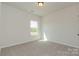 Bedroom with neutral paint, carpet, and natural light coming through the window creates a serene atmosphere at 1121 Red River Dr, Salisbury, NC 28144