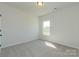 Bright bedroom with fresh paint, neutral carpet, and window bringing in light, ready for personalization at 1121 Red River Dr, Salisbury, NC 28144
