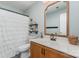A bathroom featuring a vanity with a marble countertop, a toilet, and a shower with a white shower curtain at 114 Rolling Stone Ct, Mooresville, NC 28117