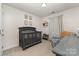 Charming Bedroom with gray crib, glider chair, neutral colors, and decorative touches for a serene environment at 114 Rolling Stone Ct, Mooresville, NC 28117