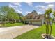 Beautiful two-story home with a well-maintained lawn, mature trees, and a two-car attached garage at 114 Rolling Stone Ct, Mooresville, NC 28117