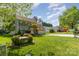Attractive two-story home with a spacious front yard, mature trees, and a two-car attached garage at 114 Rolling Stone Ct, Mooresville, NC 28117