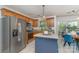 Bright kitchen boasts stainless appliances, a functional island, and a cozy breakfast nook at 114 Rolling Stone Ct, Mooresville, NC 28117