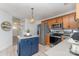 Charming kitchen with stainless appliances, functional island, and stylish light fixtures at 114 Rolling Stone Ct, Mooresville, NC 28117