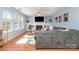 Bright living room features a fireplace, built-ins, large windows, and modern decor at 114 Rolling Stone Ct, Mooresville, NC 28117