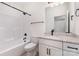 Bathroom featuring a tub/shower combo, white cabinets, granite countertops and black hardware at 120 Southern Oaks Ln, Salisbury, NC 28147