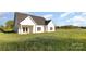 Modern farmhouse featuring a back porch and a large yard at 120 Southern Oaks Ln, Salisbury, NC 28147