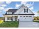 Charming new construction home features a white exterior, black shutters, and a two-car garage at 120 Southern Oaks Ln, Salisbury, NC 28147