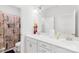A bathroom features a double sink vanity, a mirror and a shower curtain with inspirational script at 12305 Stinson Ct, Charlotte, NC 28277