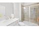 Modern bathroom featuring a glass shower, vanity with sink, and neutral color scheme at 12305 Stinson Ct, Charlotte, NC 28277