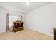 Neutral bedroom with blinds and an ornate wooden cabinet at 12305 Stinson Ct, Charlotte, NC 28277