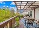 Outdoor deck featuring a patio table, seating, and scenic views at 12305 Stinson Ct, Charlotte, NC 28277