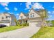 Charming two-story home with a well-manicured lawn, a covered porch, and a two-car garage at 12305 Stinson Ct, Charlotte, NC 28277