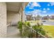 Inviting front porch with white bench seating, decorative railing and views of the neighborhood street at 12305 Stinson Ct, Charlotte, NC 28277