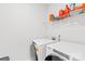 Modern laundry room features side by side washer and dryer at 12305 Stinson Ct, Charlotte, NC 28277