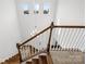 Bright foyer with a wooden staircase, a chandelier, and large windows allowing ample natural light creating an inviting entrance at 12305 Stinson Ct, Charlotte, NC 28277