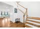 Elegant staircase featuring wood treads, white risers, and modern decor at 12305 Stinson Ct, Charlotte, NC 28277