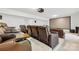 Home theater room boasting leather recliners, a projector screen, tiered platform and surround sound system at 12305 Stinson Ct, Charlotte, NC 28277