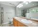 This bathroom is complete with double sinks and a glass enclosed shower at 13417 Krislyn Woods Pl, Charlotte, NC 28278