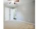 Neutral bedroom with plush carpeting and ceiling fan at 13417 Krislyn Woods Pl, Charlotte, NC 28278