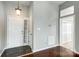 Inviting entryway featuring tile flooring, coat closet, and a front door with sidelight at 13417 Krislyn Woods Pl, Charlotte, NC 28278