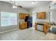 Bright eat-in kitchen featuring tile floors, stainless steel appliances, and wooden cabinets at 13417 Krislyn Woods Pl, Charlotte, NC 28278