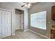 This eat-in kitchen is brightly lit with a view and a ceiling fan at 13417 Krislyn Woods Pl, Charlotte, NC 28278
