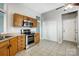 Well-lit kitchen features stainless steel appliances, wood cabinets, and neutral countertops at 13417 Krislyn Woods Pl, Charlotte, NC 28278