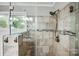 Glass shower with neutral tile and silver hardware at 13417 Krislyn Woods Pl, Charlotte, NC 28278