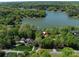 Drone shot of lake property highlighting lush canopy coverage in residential area at 1395 Roundstone Rd, Sherrills Ford, NC 28673